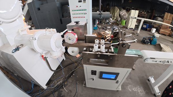 Industrial soap logo press and cutter machine in soap manufacturing workshop